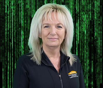 female employee with blond hair wearing a black SERVPRO shirt
