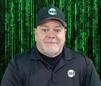 male employee posing green background