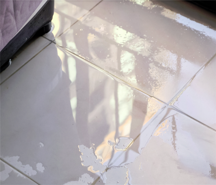 wet tile floor from recent water damage