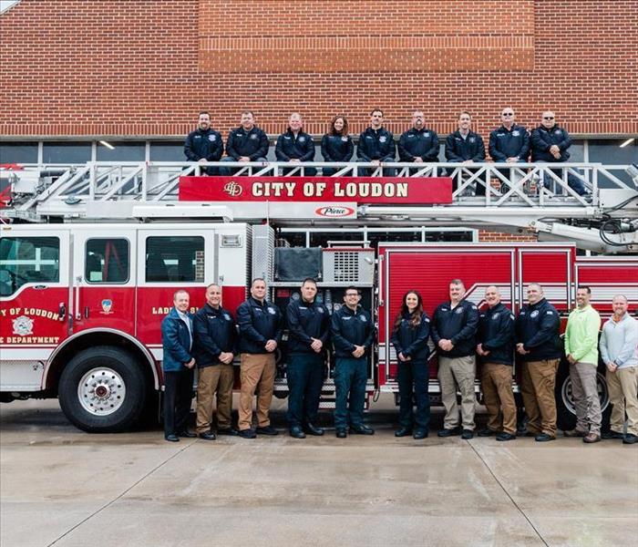 Loudon FD crew posing in front of truck