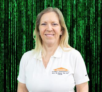 female employee with blond hair wearing a white SERVPRO shirte