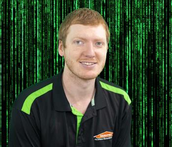 male employee posing green background